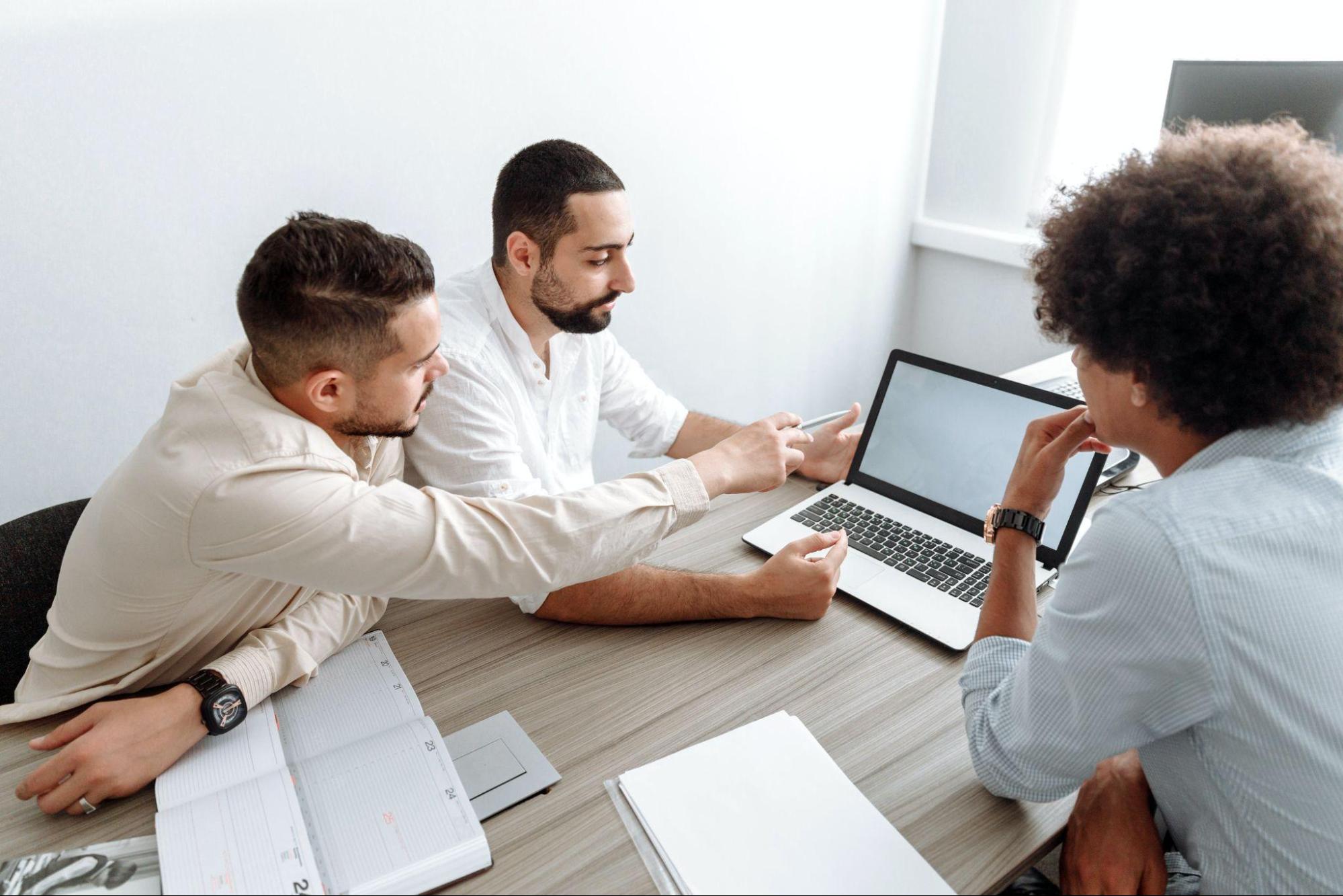 three businessmen in a meeting